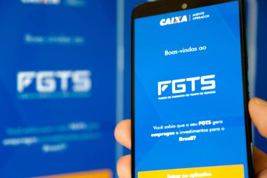 Bir cep telefonu ekranında mavi arkaplan ile Caixa fgts uygulaması.