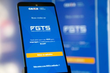 Bir cep telefonu ekranında mavi arkaplan ile Caixa fgts uygulaması.