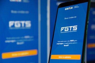 Bir cep telefonu ekranında mavi arkaplan ile Caixa fgts uygulaması.