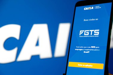 Bir cep telefonu ekranında mavi arkaplan ile Caixa fgts uygulaması.