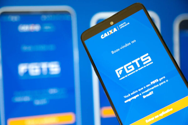 Caixa fgts application with blue background on a cell phone screen.