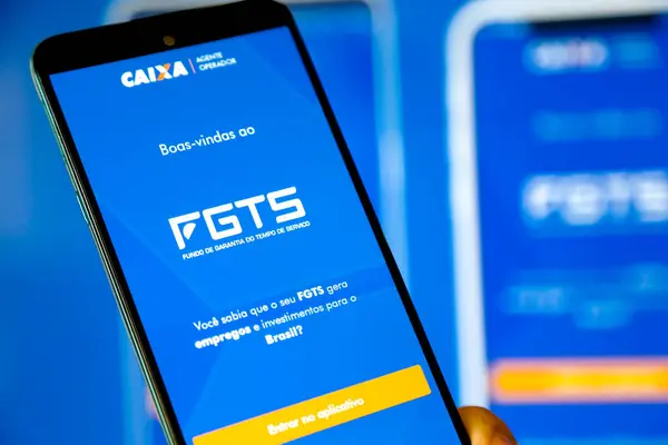 Bir cep telefonu ekranında mavi arkaplan ile Caixa fgts uygulaması.