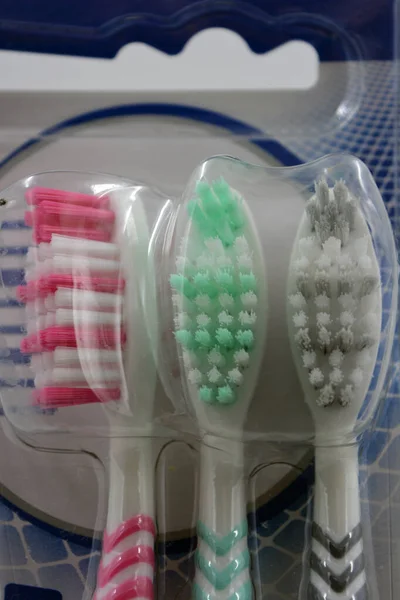Three New White Pink White Gray White Green Toothbrushes Packed — Stock Photo, Image