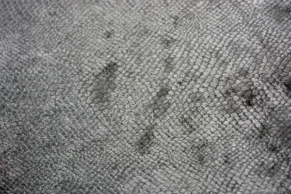 stock image Gray fluffy velvet fabric with an interesting and intriguing pattern in the form of a snake skin like fish scales with a shine and a pleasant tint.