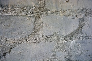 Bina arka planı, beyaz tuğladan yapılmış tuğla ve beyaz boyayla boyanmış gri çimento, ilginç ve alışılmadık bir arka plan..