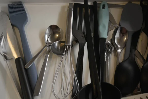 Kitchen utensils, all items like: forks, spoons, ladles, sieve, ladles, whisks, knives, spatula and many more that we usually use when preparing meals and breakfasts.