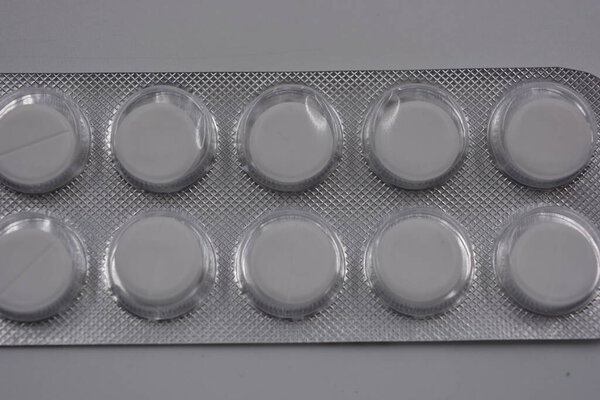 Medicine, health care, medicines, pills. Pack of tablets 10 pieces, bottles with medicines and drug packages arranged on a white background.