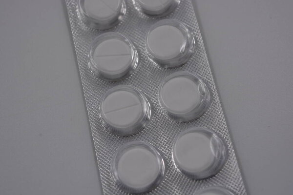 Medicine, health care, medicines, pills. Pack of tablets 10 pieces, bottles with medicines and drug packages arranged on a white background.