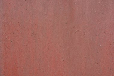 Kahverengi, kırmızı, vişne boyasıyla kaplı eski, düzensiz metal bir yüzey. Kaba kahverengi, metalik arkaplan.