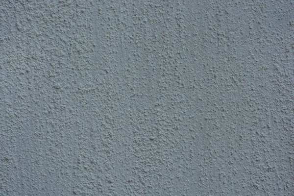 Building materials, white plaster, cladding of building walls with a pattern and structure, white bright background.