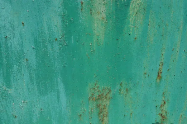 A green metal background with different divorces and shades on it