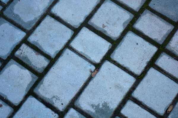 Building materials, road surface, pavement made of colored stones blue, red and yellow. Construction, building materials, unusual backgrounds made of colored stones. Photos taken in the city of Dnipropetrovsk, Dnipro country Ukraine.
