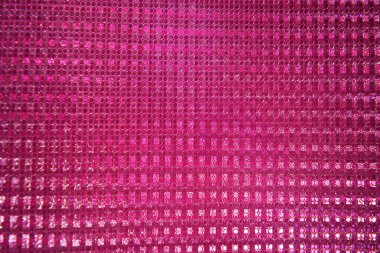 Sıradışı parlak pembe arka plan, hologram yansıtıcı etki, küçük parçacıklar yakın çekim.