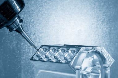 5 eksenli makine merkezi V8 motor silindir bloğunu katı top değirmeni aracıyla kesiyor. Çok eksenli CNC değirmen makinesinin yüksek hassasiyetli otomotiv üretim süreci.