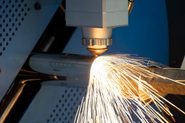 The fiber laser cutting machine cutting  machine cut the stainless steel tube. The hi-technology sheet metal manufacturing process by laser cutting machine. 