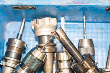 The group of various size of indexable tools in the container box. The hi-speed cutting tool for hole processing.