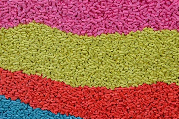 The background of multi color pigment material for injection process. The raw material of plastic processing.