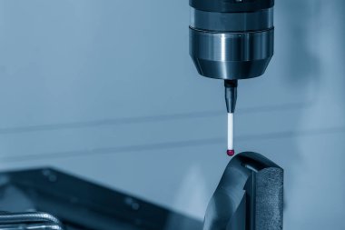 Close up scene the touching probe  measuring the metal  parts. The quality control of automotive parts with multi axis CMM machine.
