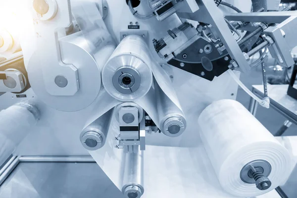 The roll of plastic bag in extrusion machine. The plastic bag manufacturing concepts. 