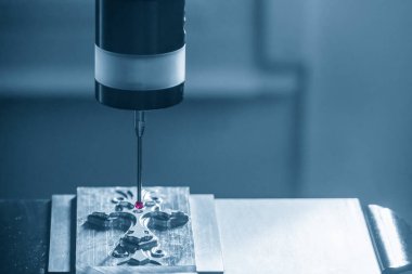 The  CMM probe measuring the  mold parts on machining center. The quality control of automotive parts with  Coordinate Measuring Machine.