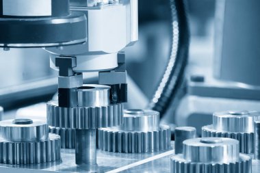 The high technology material handling by robotic system. The manufacturing concept of transmission gear parts with automatic system.