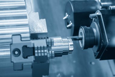 The multi-tasking CNC lathe machine  milling cut the metal shaft parts by milling turret. The high technology metal working with CNC turning machine.