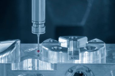 Close up scene the multi axis touching probe  measuring the aluminum  parts. The quality control of automotive parts with multi axis CMM machine.