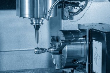 The 4-axis CNC milling machine  cutting the sample part with solid ball end mill tool. The hi-technology automotive  parts manufacturing process by 5-axis machining center.