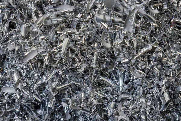 stock image Close-up scene of  aluminum  materials scrap from turning process. The pile of lathe chips.