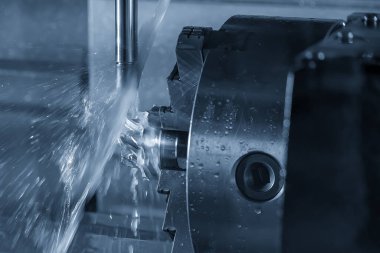 The 5-axis CNC milling machine  cutting the turbocharger part with solid ball end mill tool. The hi-technology automotive  parts manufacturing process by 5-axis machining center.