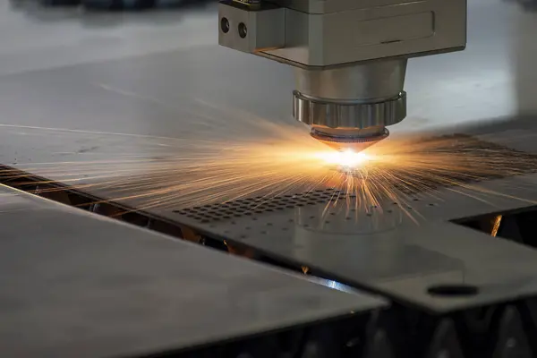 The fiber laser cutting machine  cut the metal plate with the sparkling light. The hi-technology sheet metal manufacturing process by laser cutting machine.
