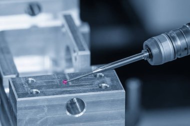 The  CMM probe measuring the  mold parts on machining center. The quality control of automotive parts with  Coordinate Measuring Machine.