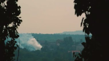 White smoke in industrial area at daytime at summer smoking
