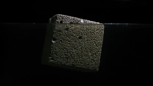Foam Concrete Cube Floating Test Water — Stock Video