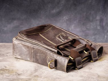 Brown leather business casual bag with clasp and handles