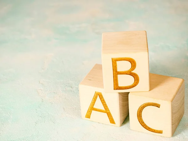 stock image ABC text on wooden cubes as alphabet concept