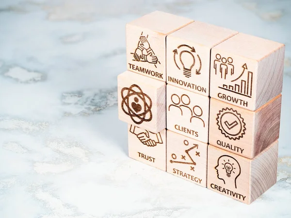 Core values symbols on wood blocks