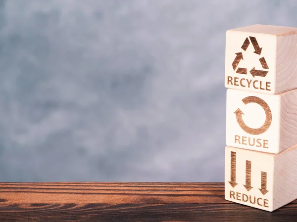 Reduce, Reuse, and Recycle symbols as an environmental conservation business concept