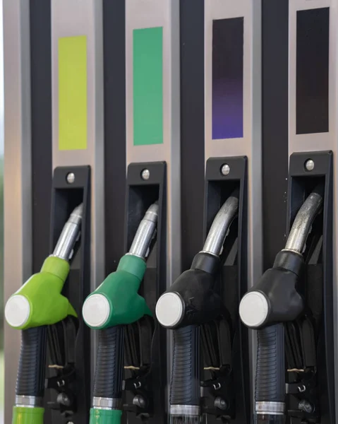 stock image purple green yellow black color fuel gasoline dispenser background. Prices increasing. Transport concept