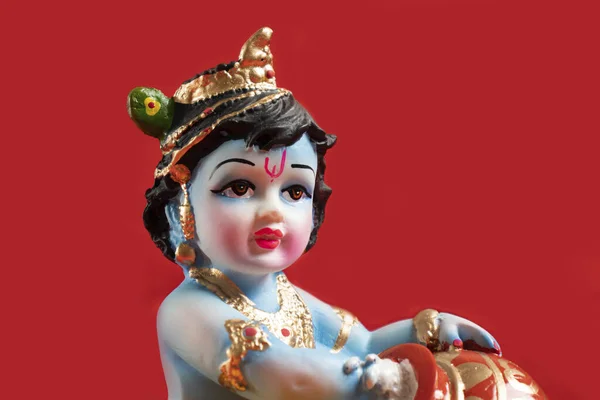 Kırmızı Arka Planda Hindu Tanrısı Krishna — Stok fotoğraf