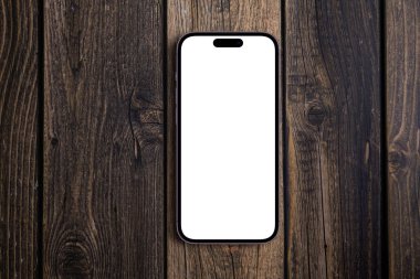 Mockup akıllı telefon iPhone 14 Pro Max, ahşap arka planda beyaz ekran, üst manzara. Apple çok uluslu bir teknoloji şirketidir. Batum, Gürcistan - 5 Ekim 2022