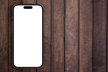 Mockup akıllı telefon iPhone 14 Pro Max, ahşap arka planda beyaz ekranı var. Apple çok uluslu bir teknoloji şirketidir. Batum, Gürcistan - 26 Ekim 2022