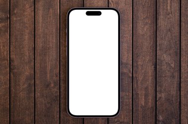 Mockup akıllı telefon iPhone 14 Pro Max. Ahşap arka planda beyaz ekran üst görüntüsü var. Apple çok uluslu bir teknoloji şirketidir. Batum, Gürcistan - 26 Ekim 2022