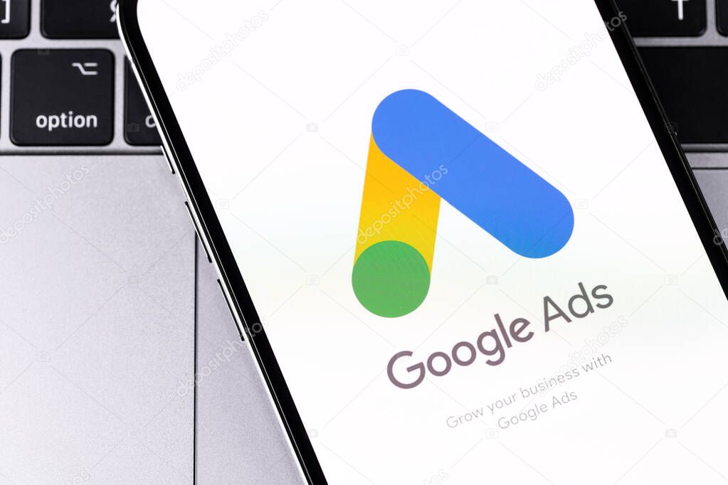 Google Ads logo mobile app on the screen smartphone iPhone, notebook closeup. Ads is a service of contextual, basically, search advertising from Google. Batumi, Georgia - March 2, 2023