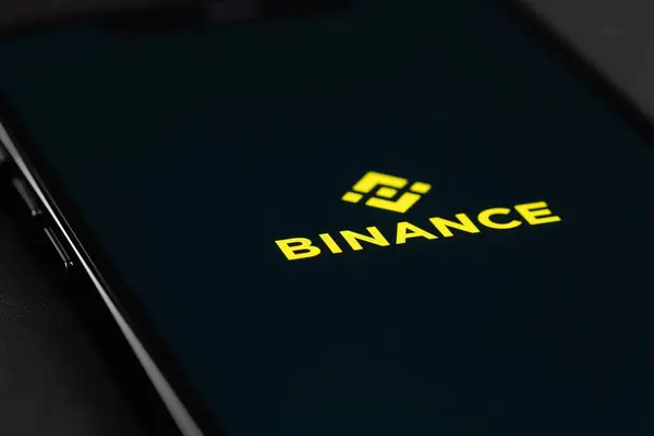 stock image Binance logo mobile app on a screen smartphone iPhone closeup, macro. Binance - one of the largest cryptocurrency exchange on the market. Batumi, Georgia - September 25, 2023