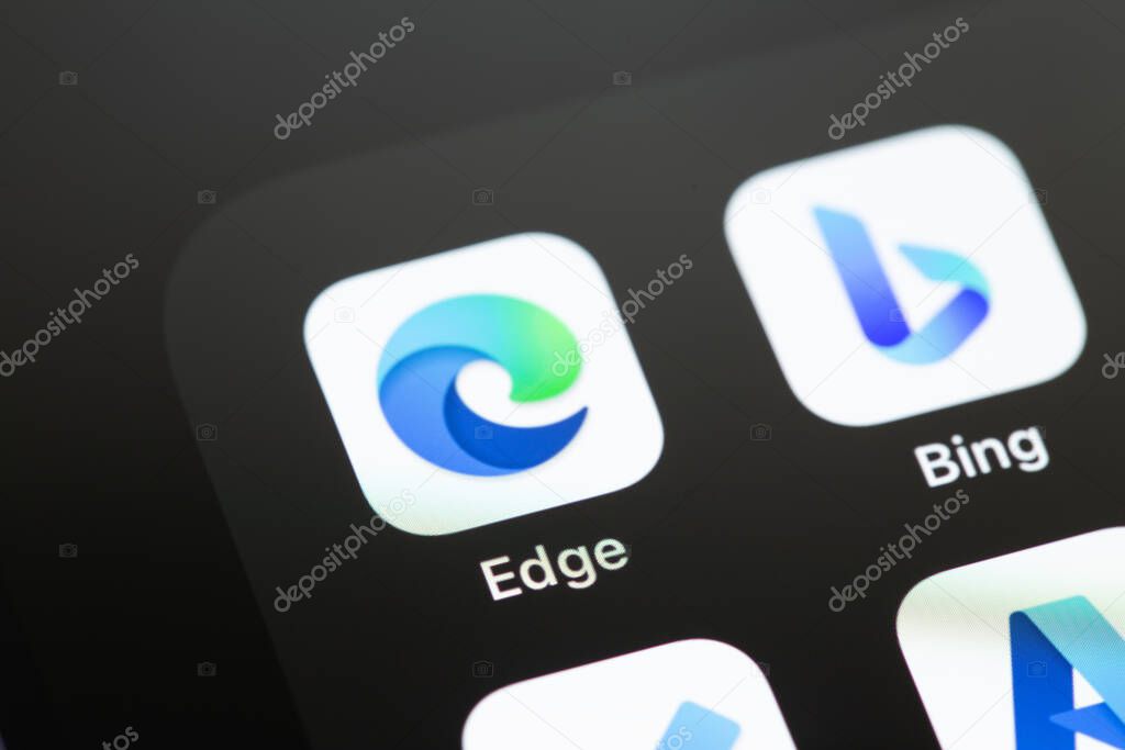 Microsoft Edge and Bing mobile apps on the screen smartphone iPhone closeup. Microsoft Edge is a browser from Microsoft. Batumi, Georgia - April 24, 2023