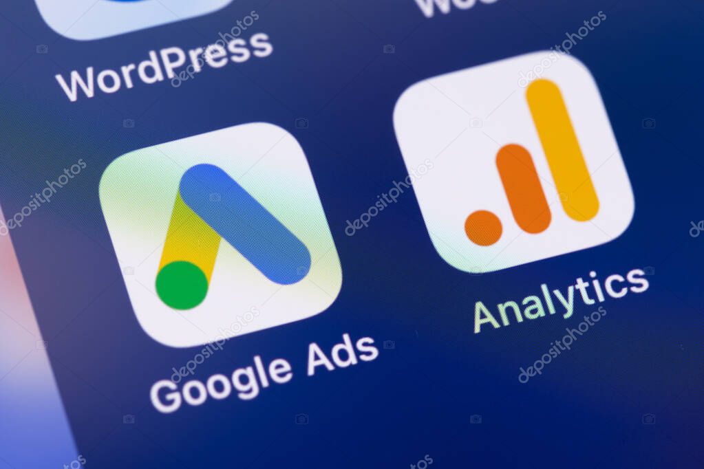 Google Ads, Analytics mobile app on a screen smartphone iPhone. Ads or Ad, AdWords is a service of contextual, basically, search advertising from Google. Batumi, Georgia - November 26, 2023