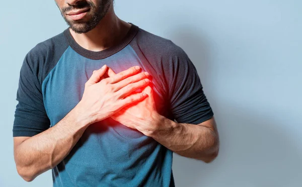 People with chest pain isolated, young man with tachycardia, man with heart pain on isolated background, young man with heart pain. Concept of people with heart problems