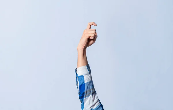 stock image Hand gesturing the letter X in sign language on an isolated background. Man's hand gesturing the letter X of the alphabet isolated. Letter X of the alphabet in sign language