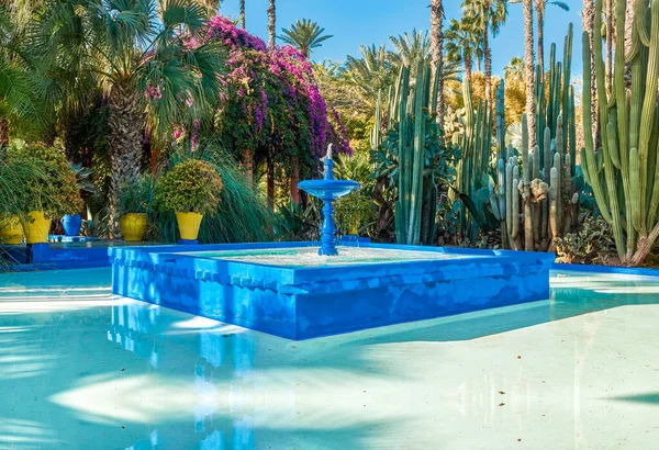 stock image Water fountain in the patio of blue color, a blue fountain of water in the patio